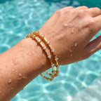 Gold Prismatic Bangle — worn poolside, waterproof lifestyle view, Krystal Jewels
