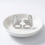 KJ-AI-GALLERY-v1 | Iridescent Double Heart Earrings — occasion scene | Krystal Jewels