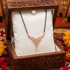 Decorative necklace in a wooden box with floral and candle elements