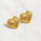 KJ-AI-GALLERY-v1 | Ribbed Heart Earrings — styled flat-lay | Krystal Jewels