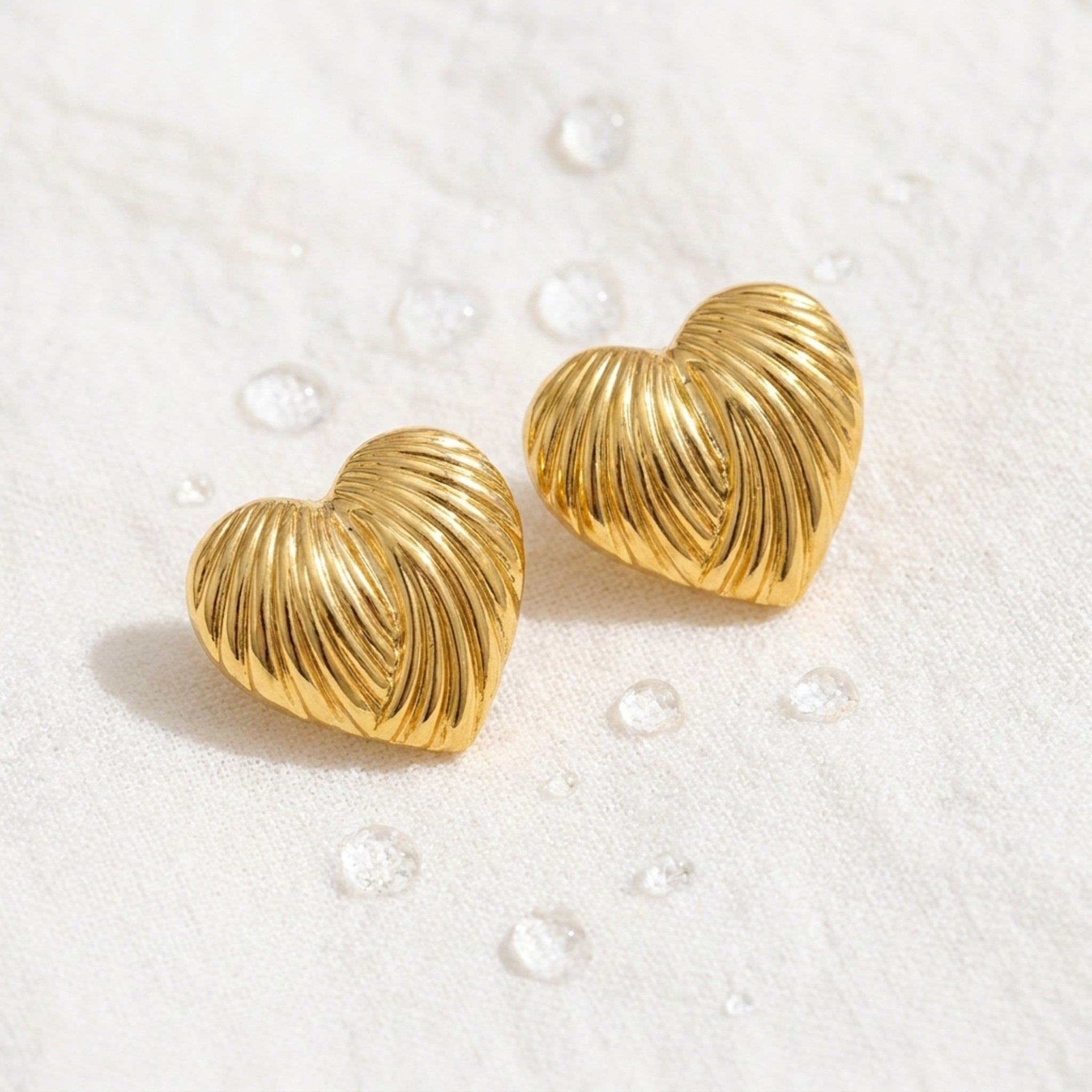 KJ-AI-GALLERY-v1 | Ribbed Heart Earrings — styled flat-lay | Krystal Jewels