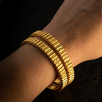 KJ-AI-GALLERY-v1 | Royal Ridge Gold Bangle Set — worn close-up editorial | Krystal Jewels