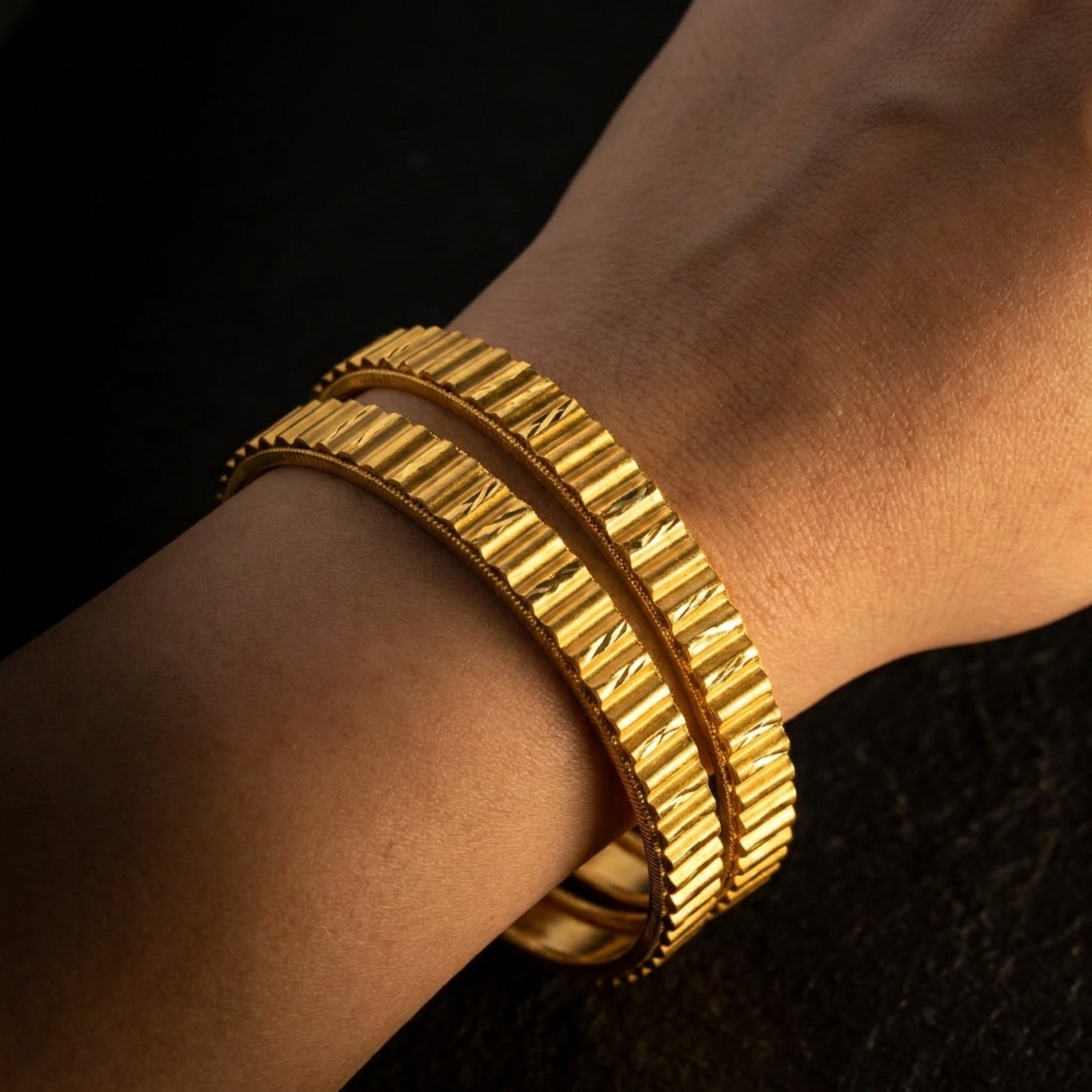 KJ-AI-GALLERY-v1 | Royal Ridge Gold Bangle Set — worn close-up editorial | Krystal Jewels