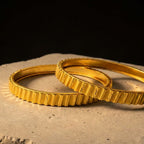 KJ-AI-GALLERY-v1 | Royal Ridge Gold Bangle Set — styled flat-lay | Krystal Jewels
