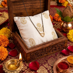 Decorative setup with a wooden box, pillow, and jewelry on a festive background.