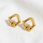 KJ-AI-GALLERY-v1 | Sculptural Open-Work Abstract Studs Earrings — styling flat-lay | Krystal Jewels
