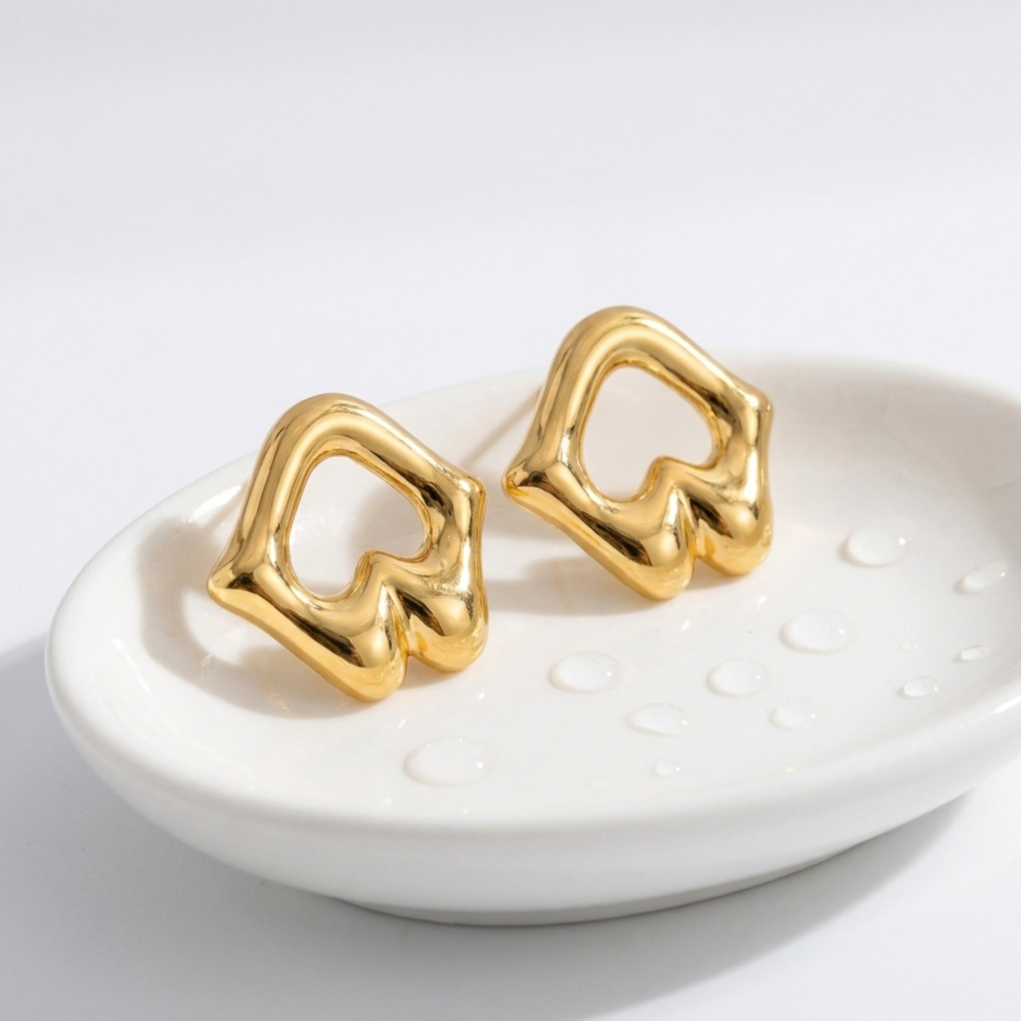 KJ-AI-GALLERY-v1 | Sculptural Open-Work Abstract Studs Earrings — occasion scene | Krystal Jewels