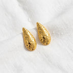 KJ-AI-GALLERY-v1 | Textured Crescent Moon Studs Earrings — styled flat-lay | Krystal Jewels