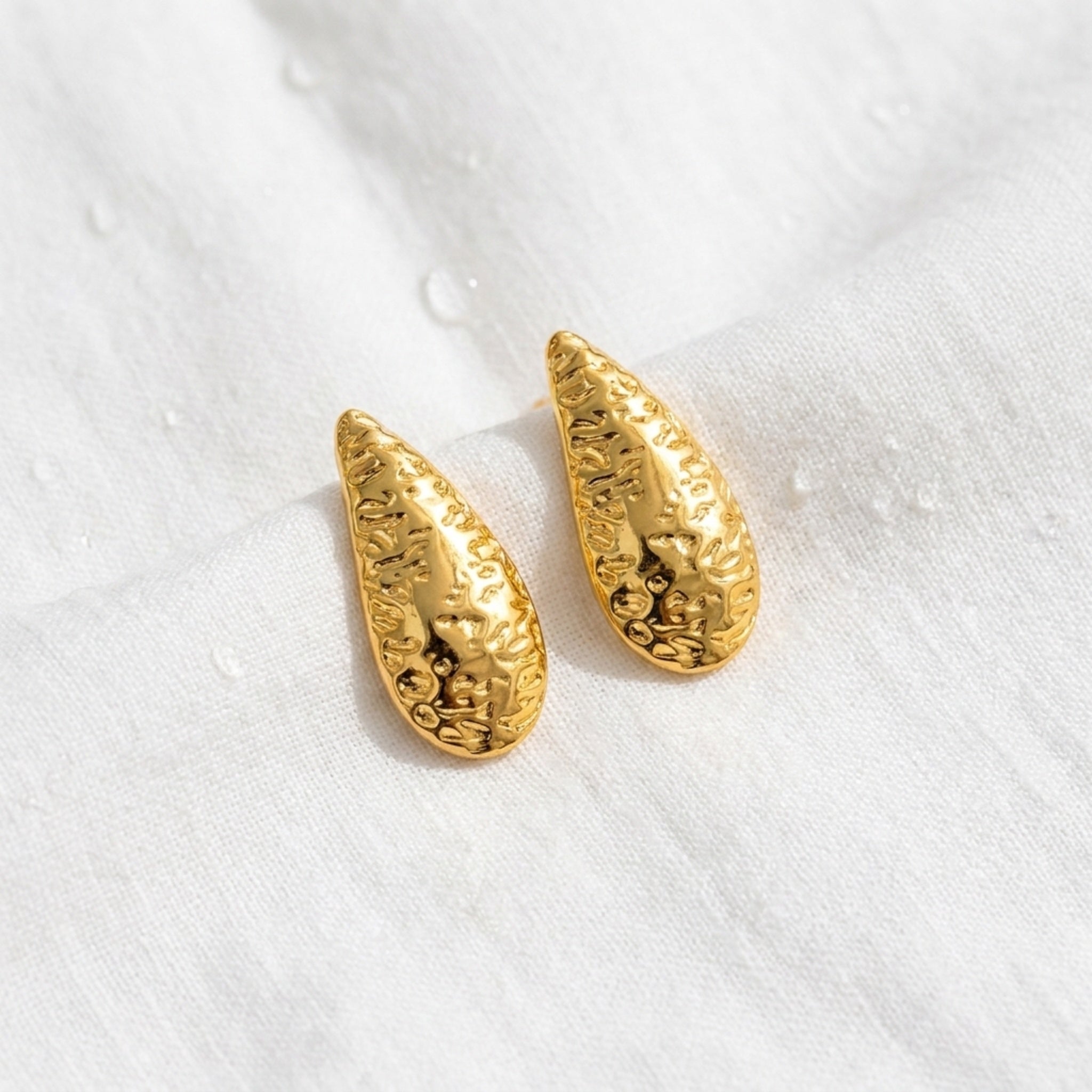 KJ-AI-GALLERY-v1 | Textured Crescent Moon Studs Earrings — styled flat-lay | Krystal Jewels
