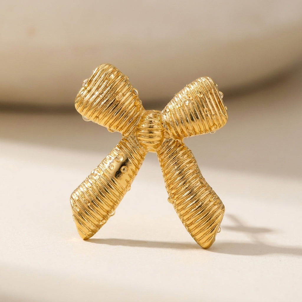 KJ-AI-GALLERY-v1 | Textured Ribbon Bow Earrings — macro detail | Krystal Jewels