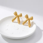 KJ-AI-GALLERY-v1 | Textured Ribbon Bow Earrings — occasion scene | Krystal Jewels