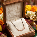 Wooden jewelry box with a necklace on a decorative background